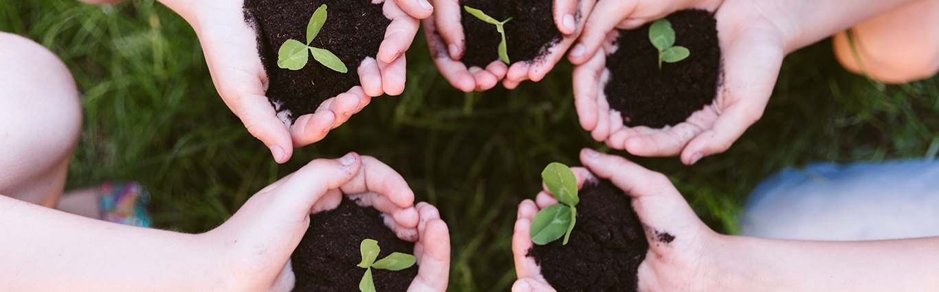 Children holding plants.