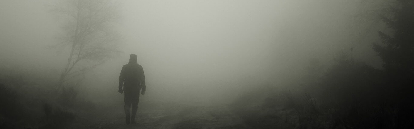 Man walking in the fog